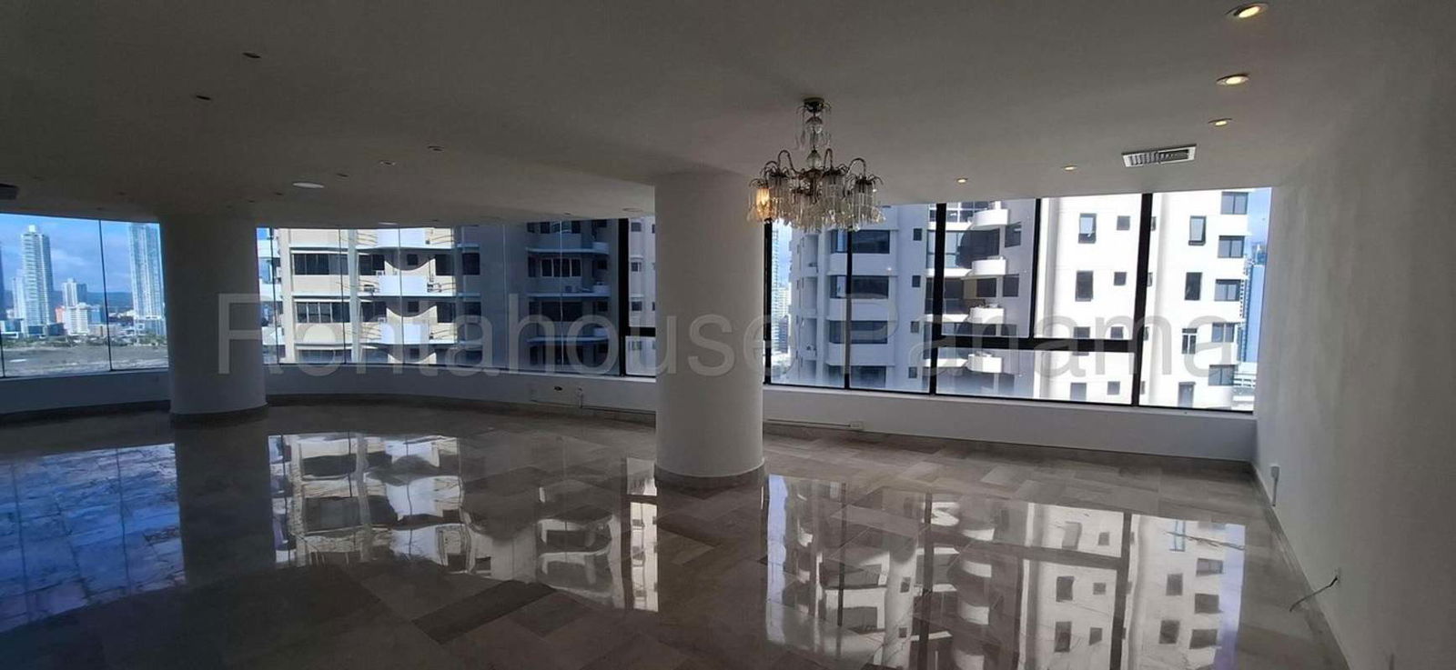 Marble elevator lobby with stainless steel doors PH Costa Pacifica luxury apartment Panama