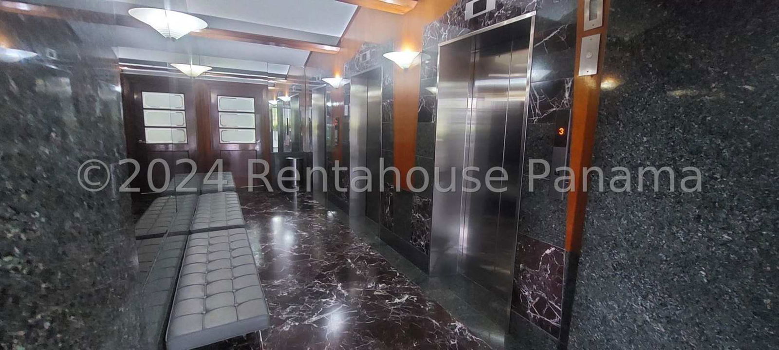 Bright panoramic living room with marble floors and city skyline views PH Costa Pacifica Panama