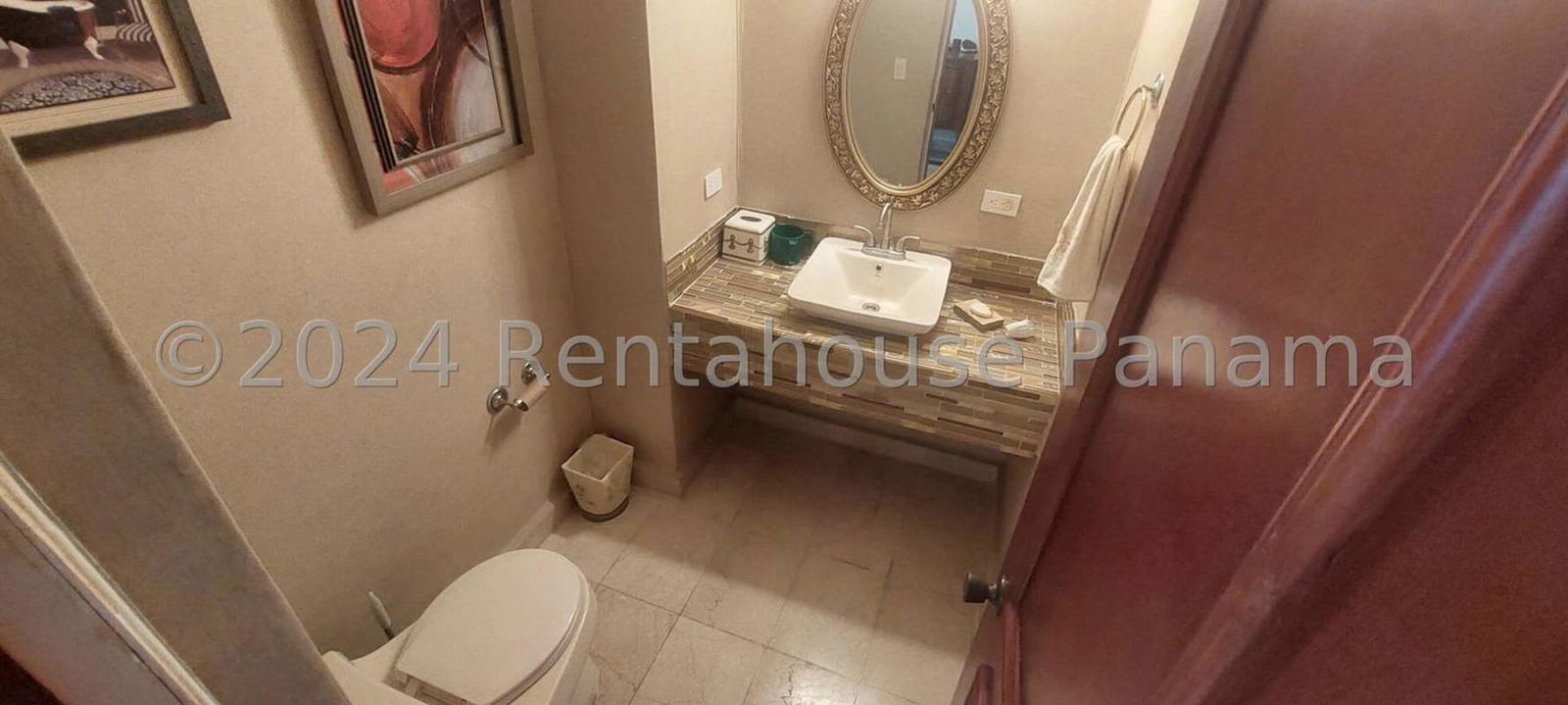 Contemporary bathroom with marble floors, double sinks, glass shower, and city views Punta Paitilla
