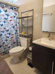 Modern bathroom with vanity and walk-in shower in Woodlands house for sale Panama