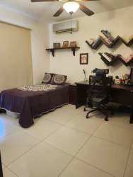 Contemporary kitchen with granite countertops stainless refrigerator in Woodlands Panama Pacifico