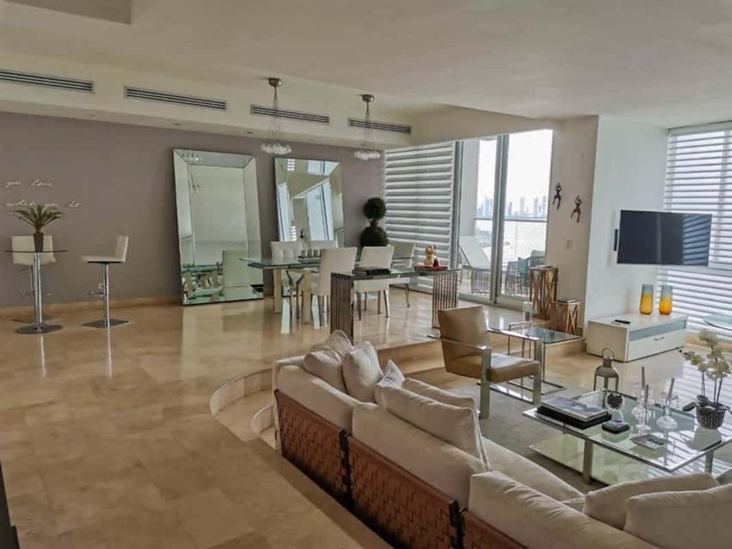 Spacious modern living dining with ocean views marble floors in PH Pacific Point Panama