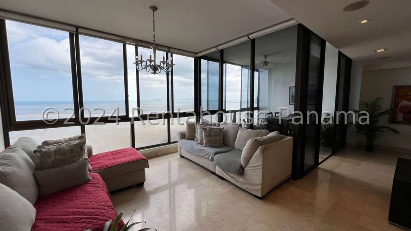 Spacious kitchen with black granite countertops and wood cabinetry PH Mirador Costa del Este Panama