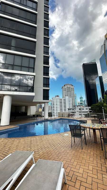 Modern white kitchen with granite countertops and ample cabinetry in PH Vista Tower Panama City