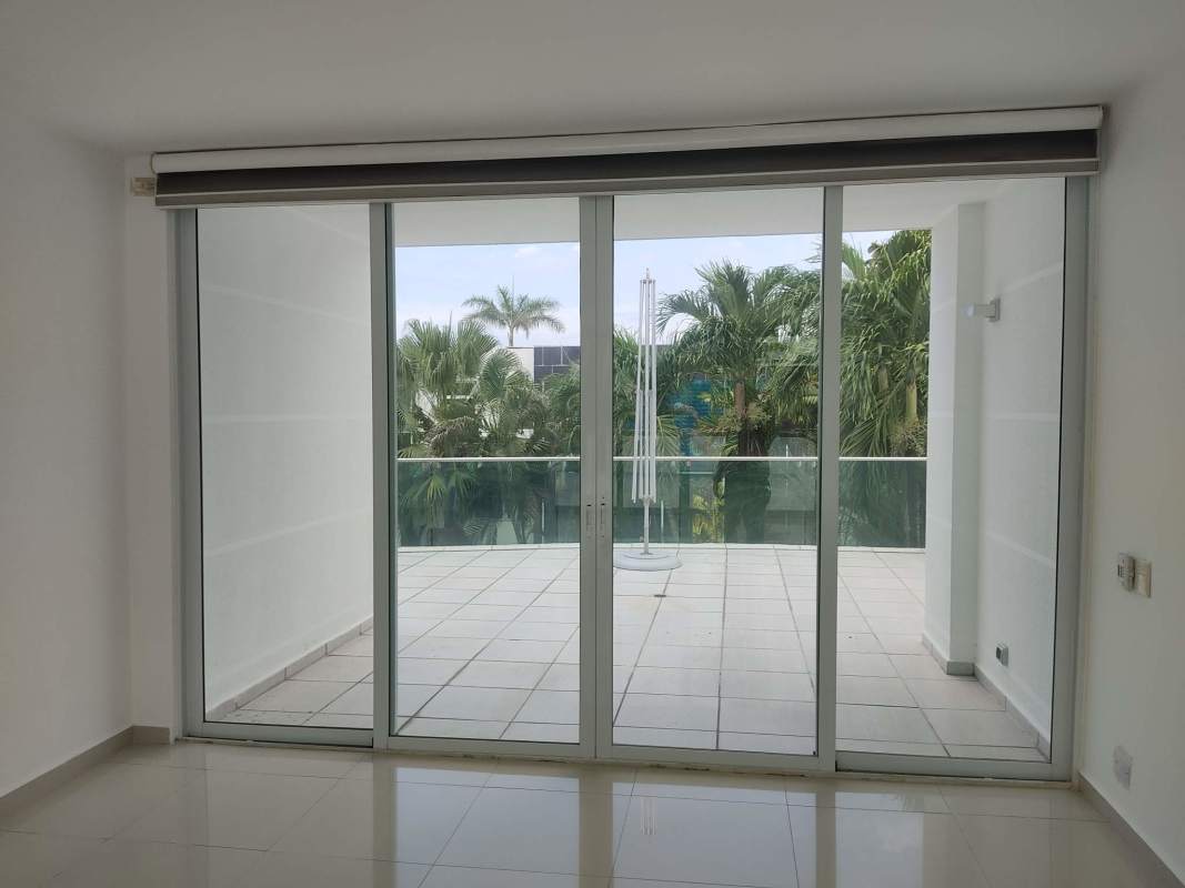 Spacious outdoor terrace overlooking private pool and garden in Costa Sur Panama