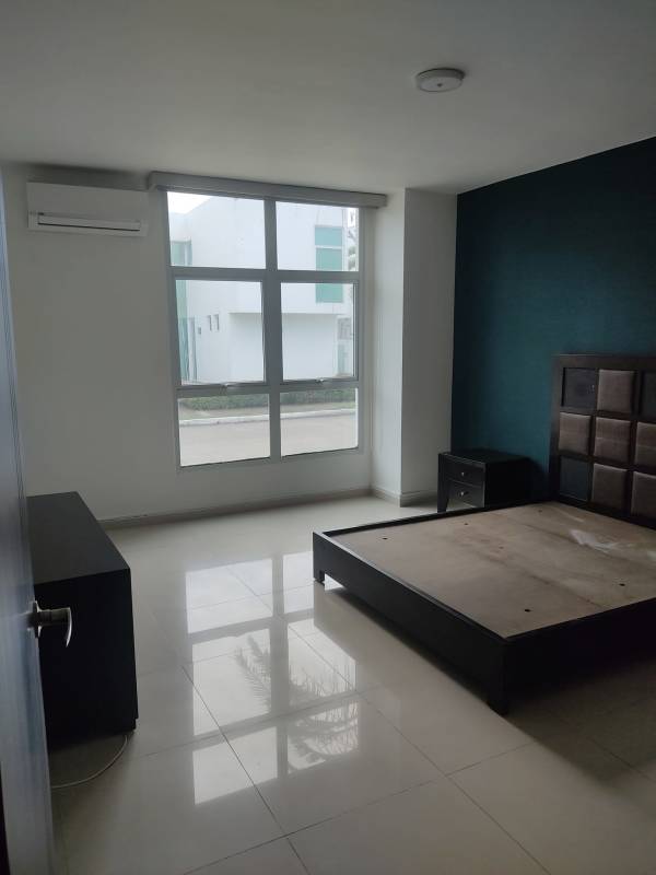 Large open living area with sliding doors to pool and garden Costa Sur Panama