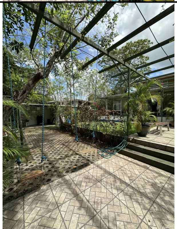 Covered enclosed patio with tiled floor, garden view Ancon Panama