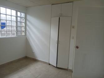 Bedroom with glass block window and built-in wardrobe San Cristobal