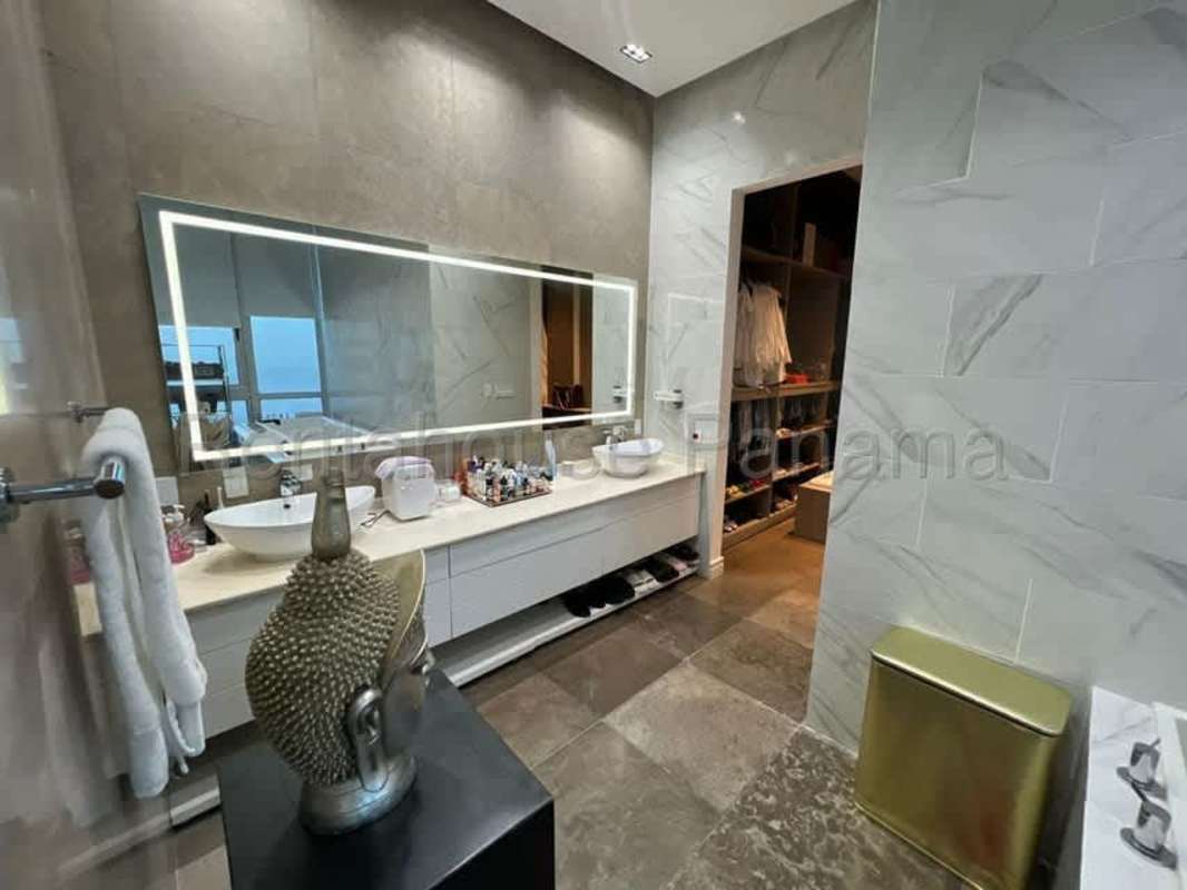 High-end modern kitchen with sleek cabinetry, stone countertops, and premium appliances at PH Ocean Front Punta Pacifica