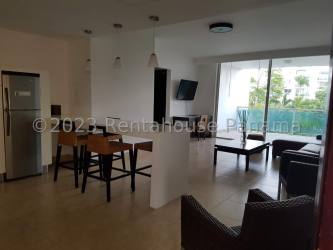 Modern living room with glass doors to oceanview balcony at Nikki Beach Residences Panama