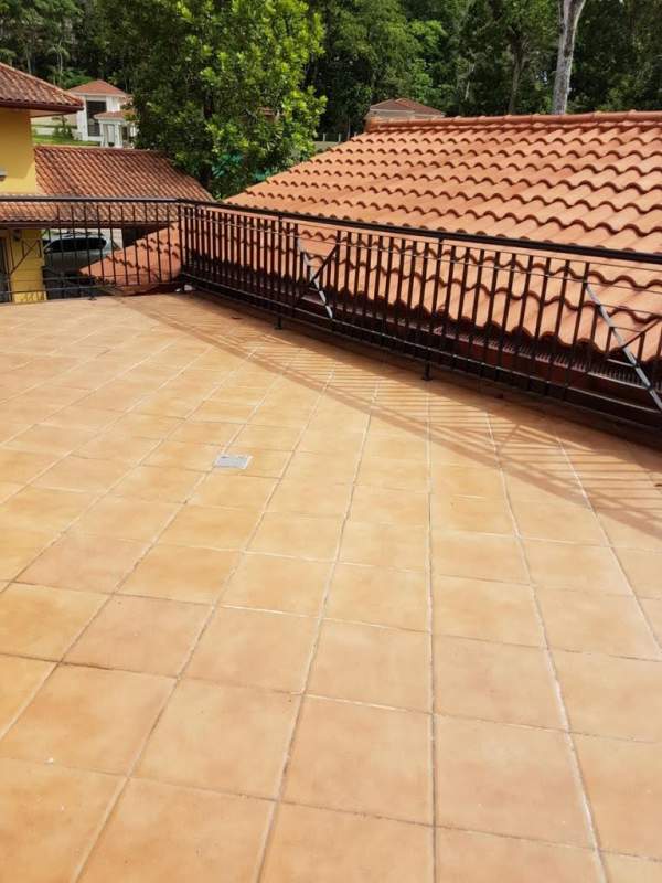Large terrace with terracotta tiles and garden area luxury house in Los Senderos Clayton Panama City