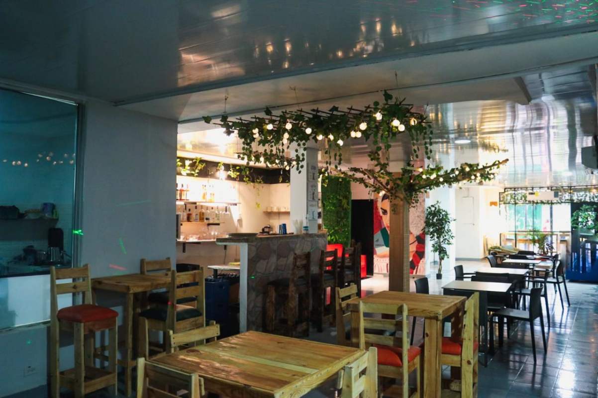 Interior with modern bar, mural artwork and mixed seating, Casco Viejo Panama commercial property