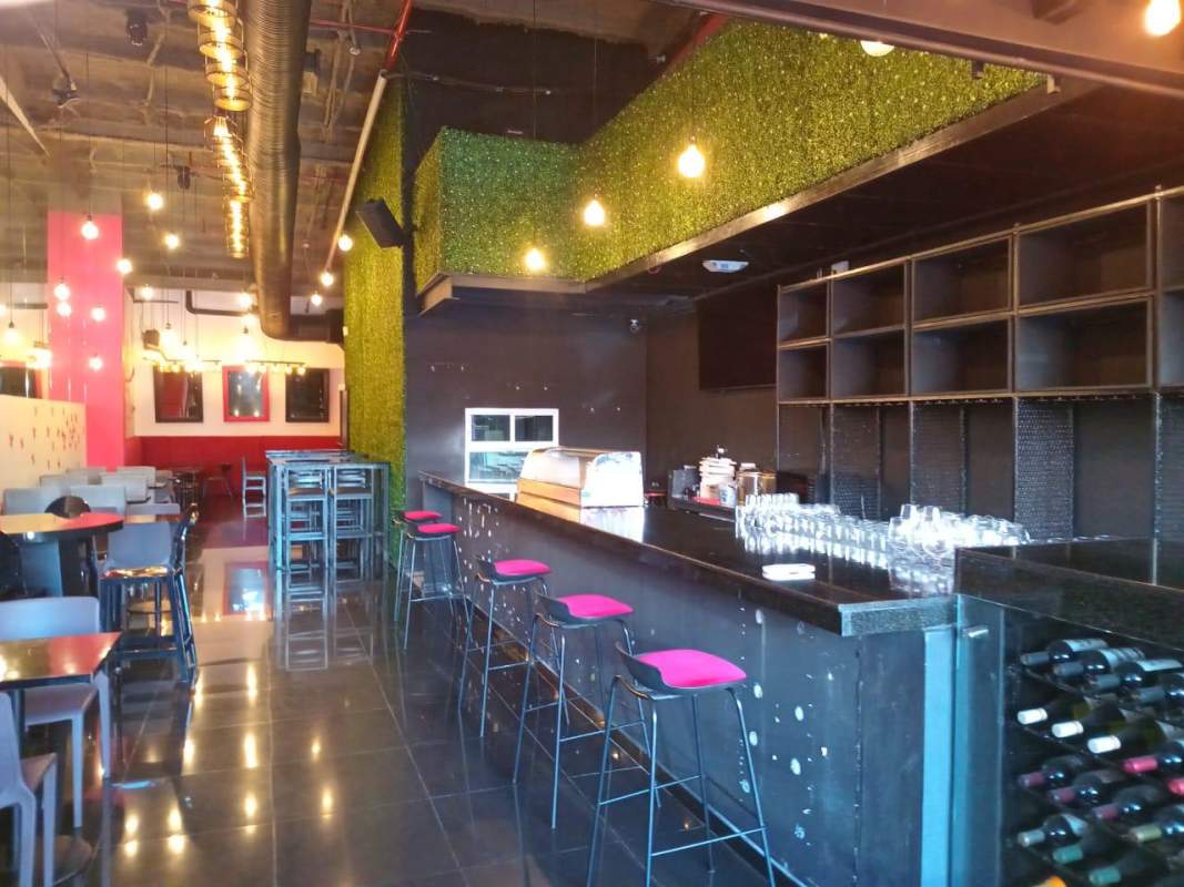 Bar and dining seating with greenery decor PH San Francisco Plaza in Panama City