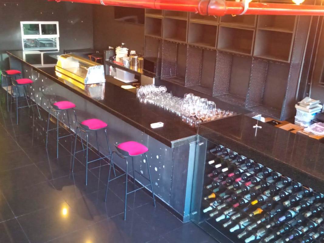 Retail commercial bar counter area with pendant lights, granite tops PH San Francisco Plaza