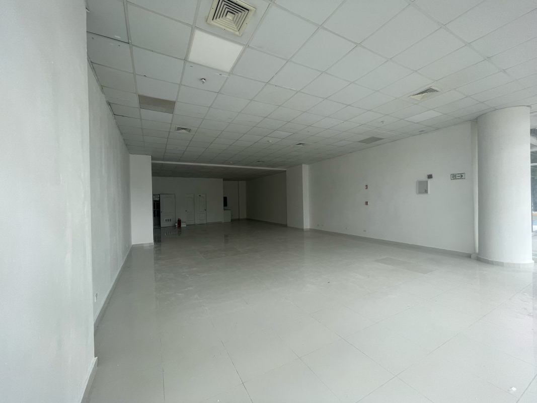 Empty corner retail or office space with large glass windows and tiled flooring in Punta Pacífica Panama