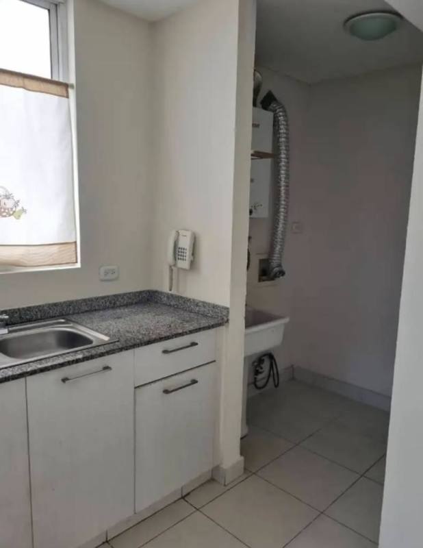 Empty bedroom with built-in wardrobe, tiled flooring, window at Torres de Cantabria Panama City