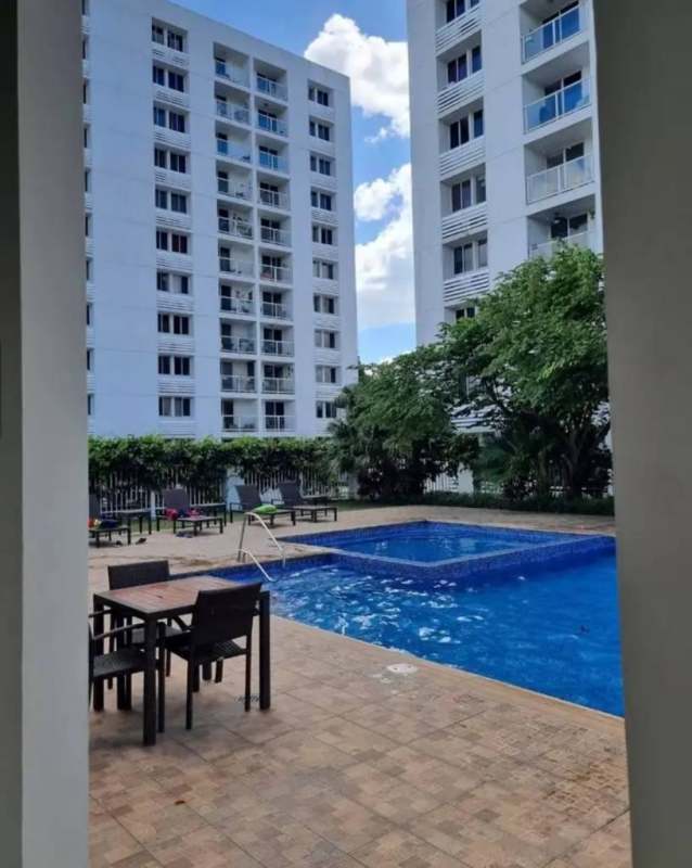 Apartment complex with outdoor swimming pool and social space at Torres de Cantabria Panama City