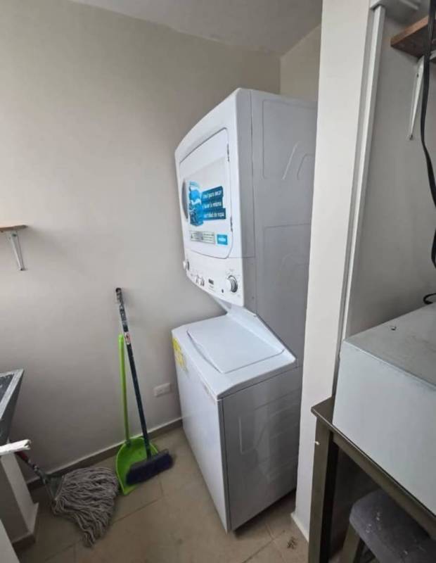 Modern bathroom with vessel sink shower enclosure striped ceiling Mystic Tower Panama