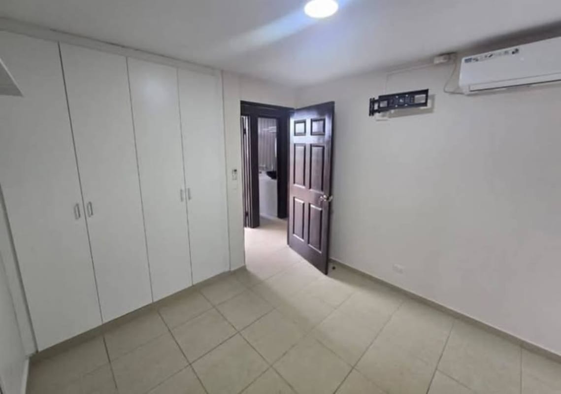 Bedroom with built-in closet AC tile floor minimalist style Mystic Tower Panama