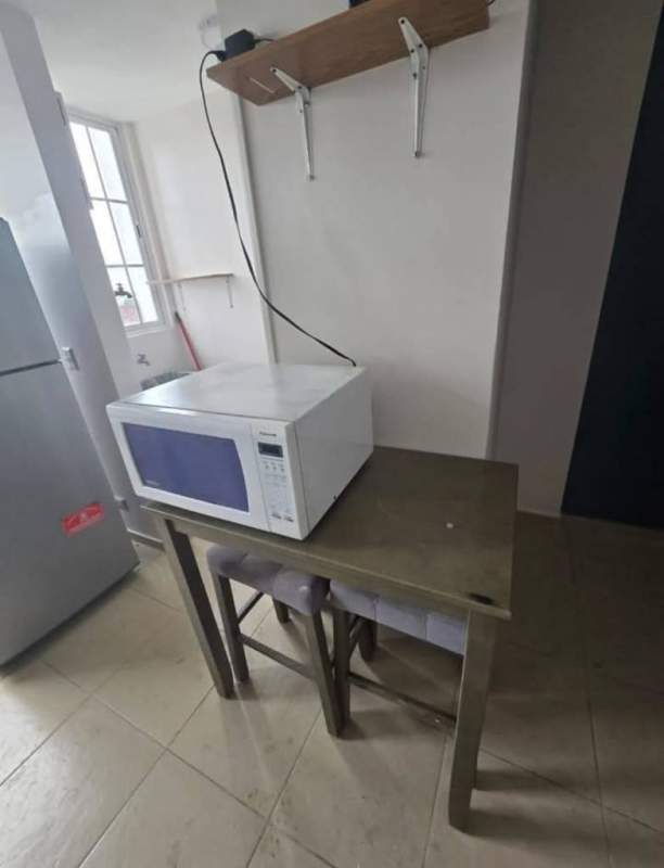 Small kitchen dining with microwave fridge table window Mystic Tower Panama