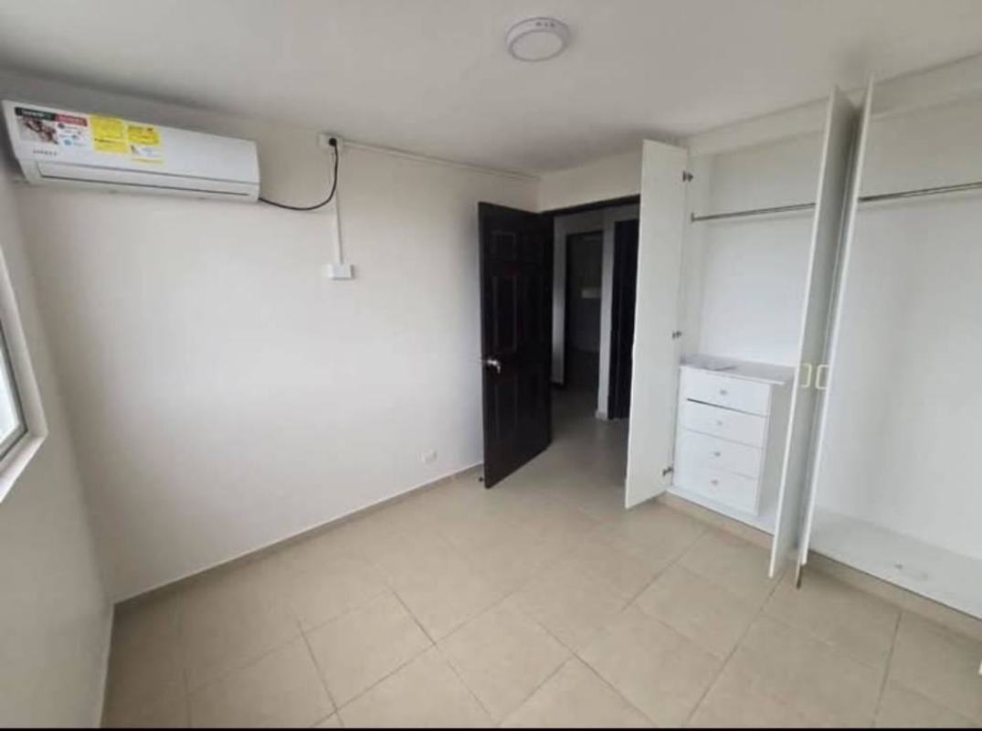Empty bedroom tiled floor AC large window black door Mystic Tower Panama