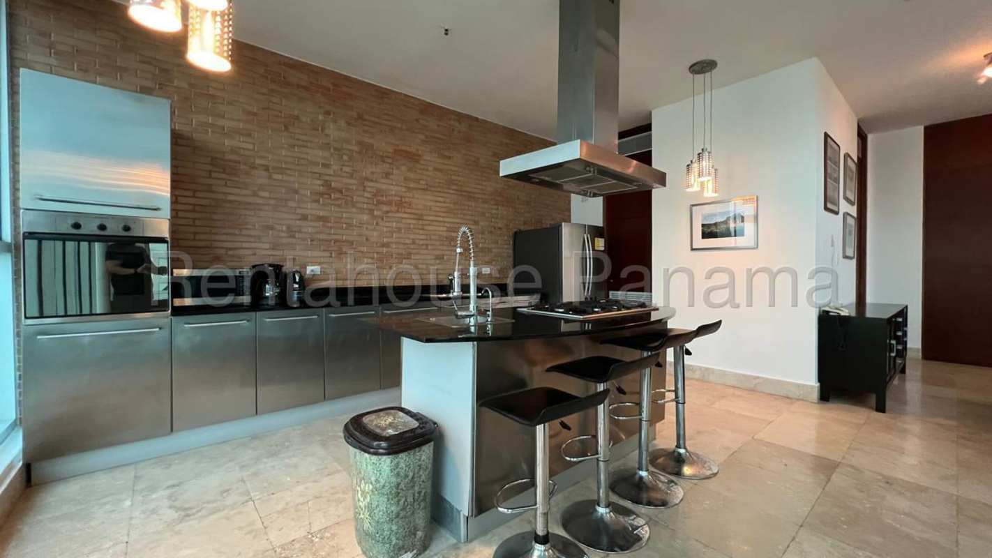 Stylish modern kitchen with granite counters, brick accent, stainless appliances PH Ocean View Panama