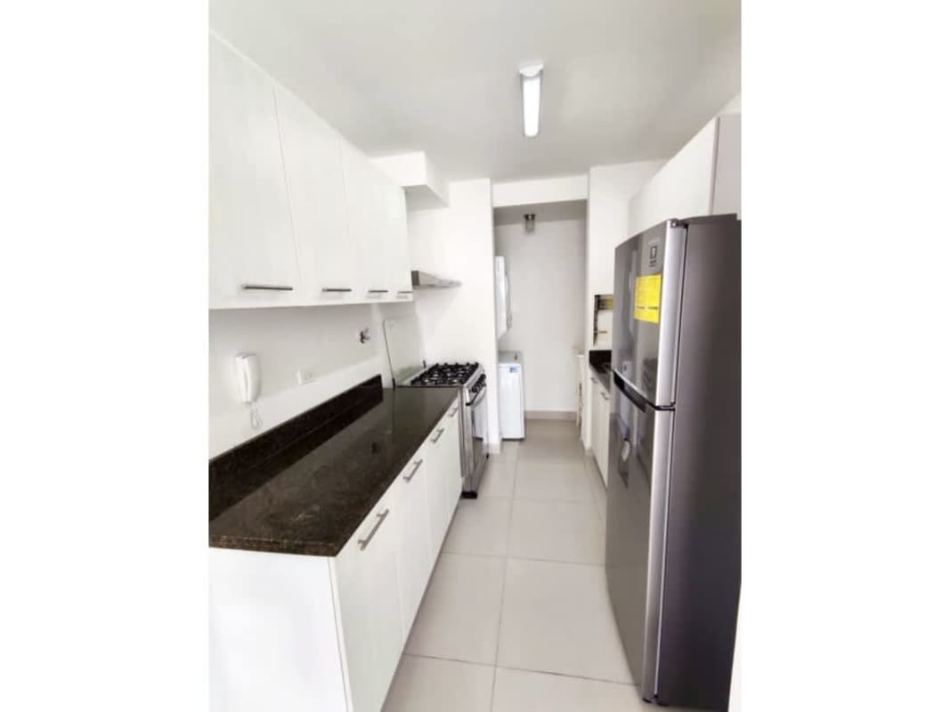 Contemporary bathroom with granite countertop, mirror, shower enclosure at PH Tee One Panama City