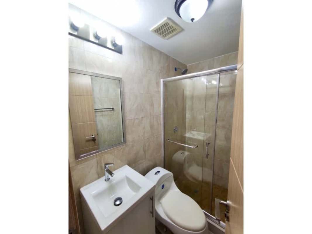 Bathroom featuring glass shower, granite vanity, modern fixtures at PH Tee One Panama City