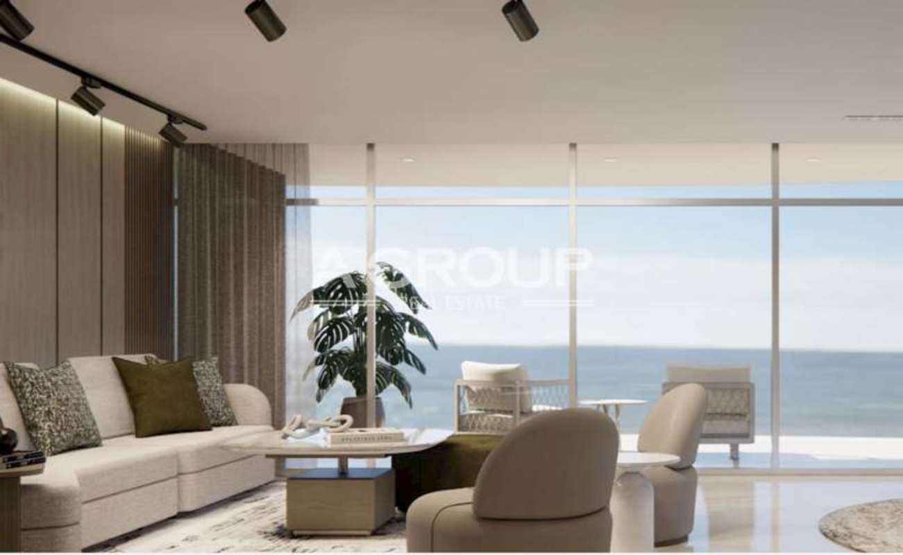 Bright modern living room with ocean view windows in Allure Punta Pacifica Panama luxury condo