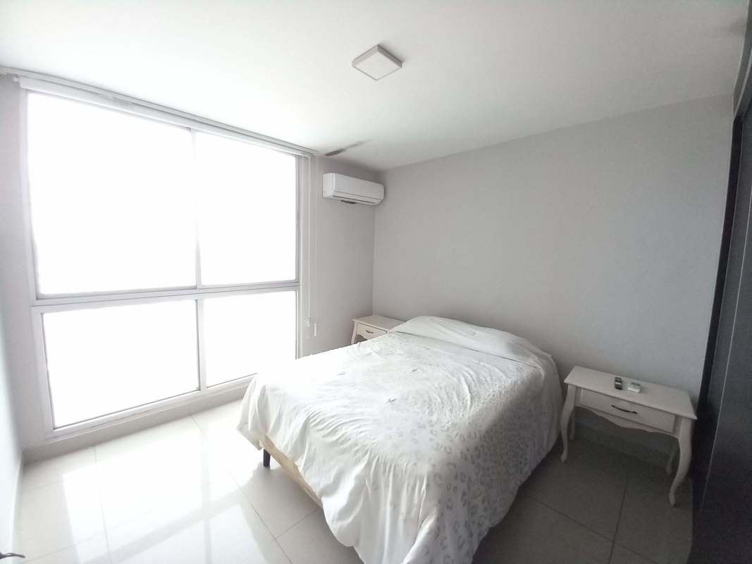 Bright second bedroom with built-in closet and large window in PH Coral Tower Carrasquilla Panama City