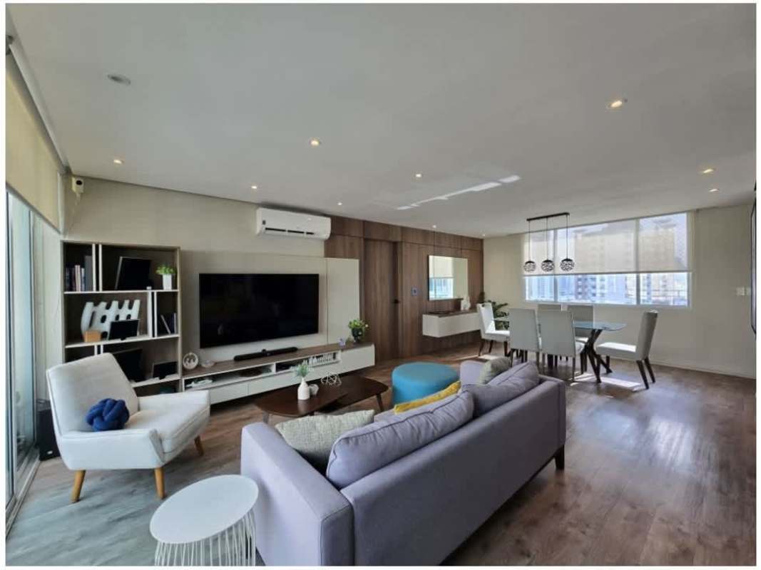 Double sink bathroom with glass shower enclosure and modern fixtures in PH 7400 EAST Panama