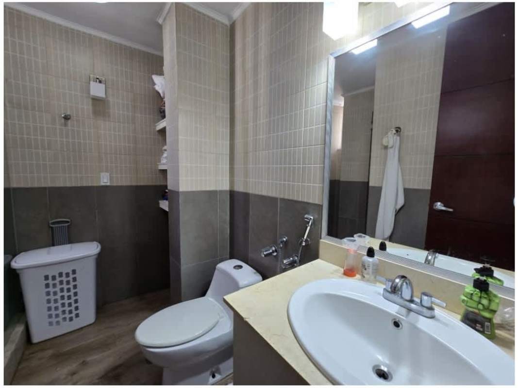 Modern kitchen with island and panoramic window view in PH 7400 EAST San Francisco Panama