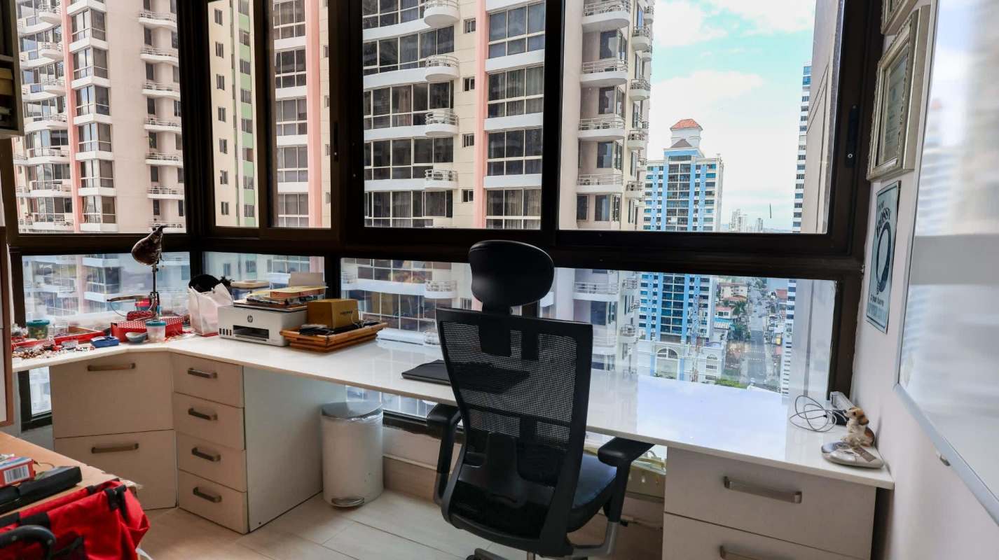Home office space with large windows and city skyline ocean view in Panama City