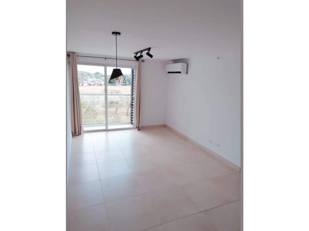 Living and dining space with sliding door to balcony in Panama Viejo Residences apartment