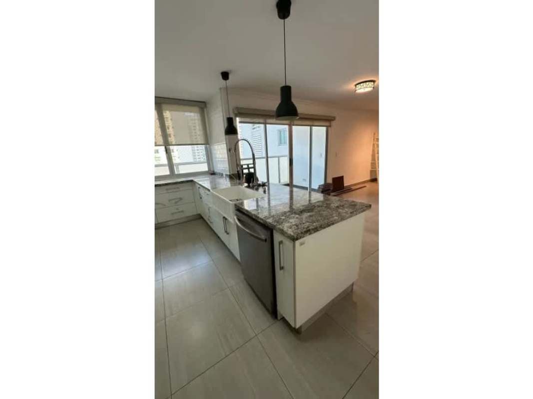 Spacious living room with large windows and natural light at PH Coco del Mar