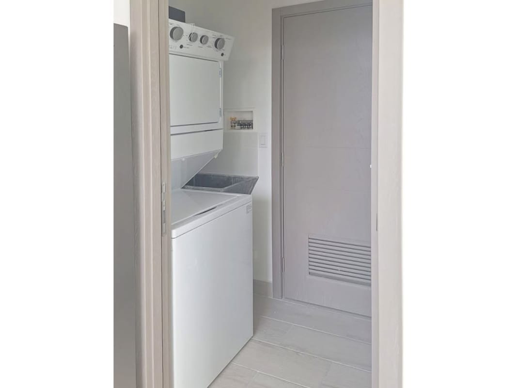 Contemporary bathroom with glass shower enclosure and dual sinks in PH Urbana Panama City