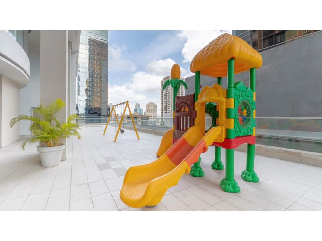 Colorful outdoor playground area for children at PH Urbana in Obarrio Panama