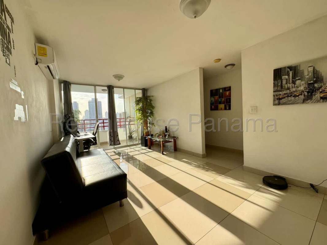 Bright living room with balcony access, tile floors and city views in PH El Marquez Panama City