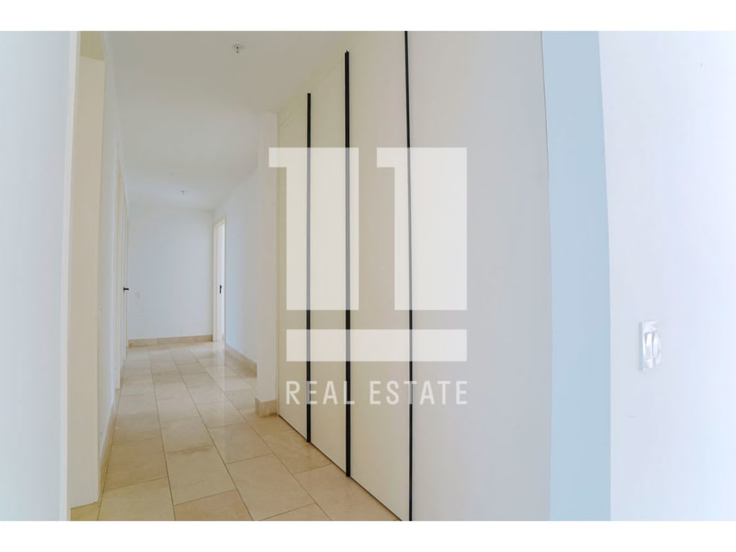 Modern bathroom with double sink, marble finishes and glass shower in PH Caleta Coco del Mar Panama