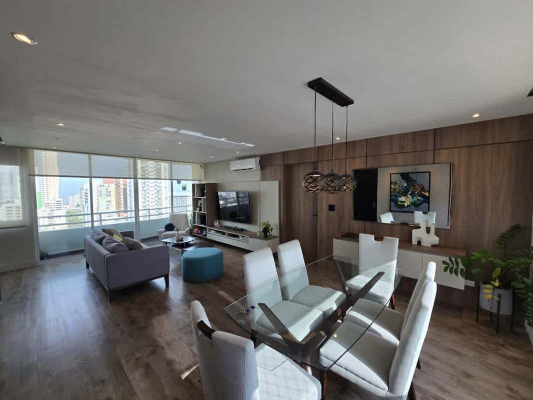 Open-plan living dining area with large windows and city skyline views PH San Francisco Bay Panama City