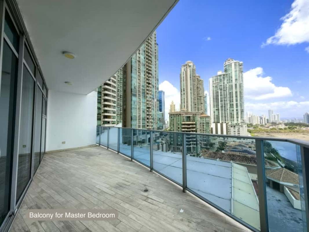 Master bedroom with private balcony offering Pacific Ocean views at Grand Tower Punta Pacifica Panama