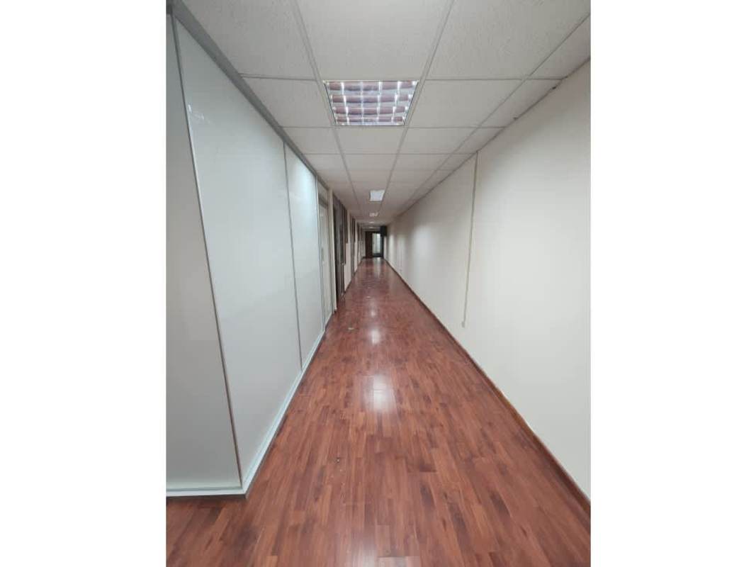 Long corridor with glass partitions in commercial office PH BICSA Panama City
