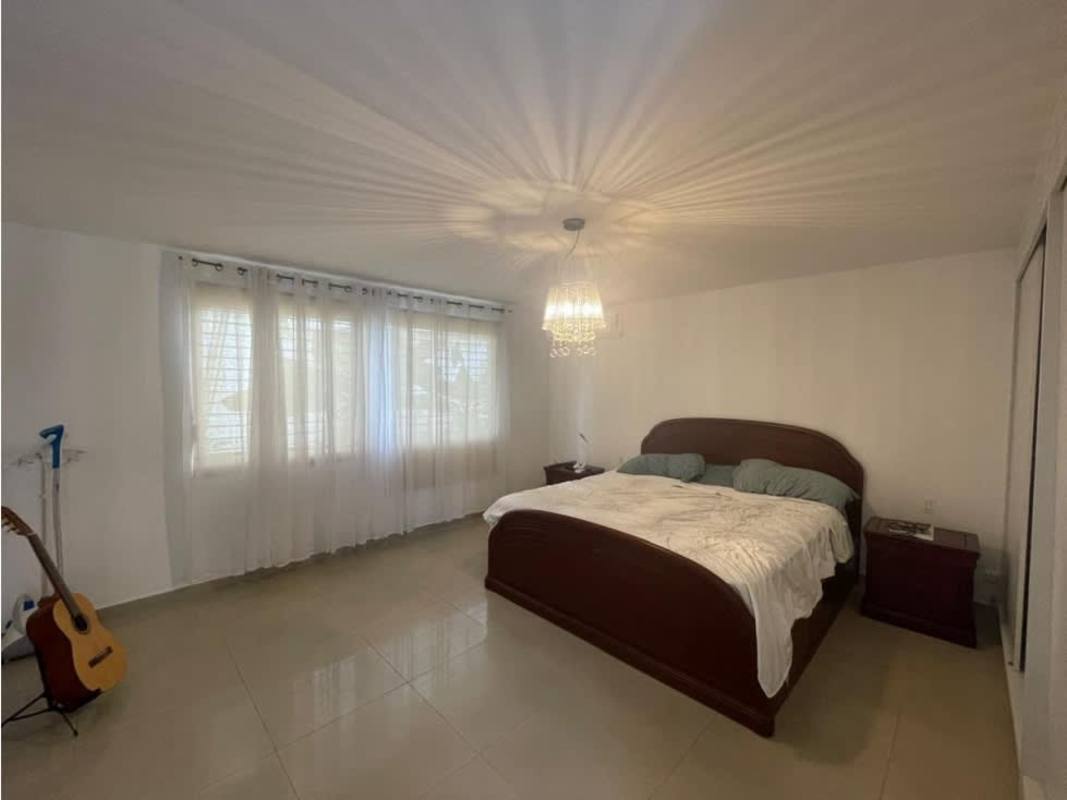 Kitchen with granite countertop and white cabinets in spacious house for rent El Carmen Panama City