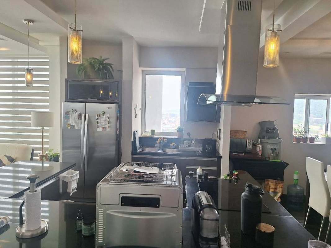 Second bedroom with large window and skyline view in PH Rivage Avenida Balboa Panama