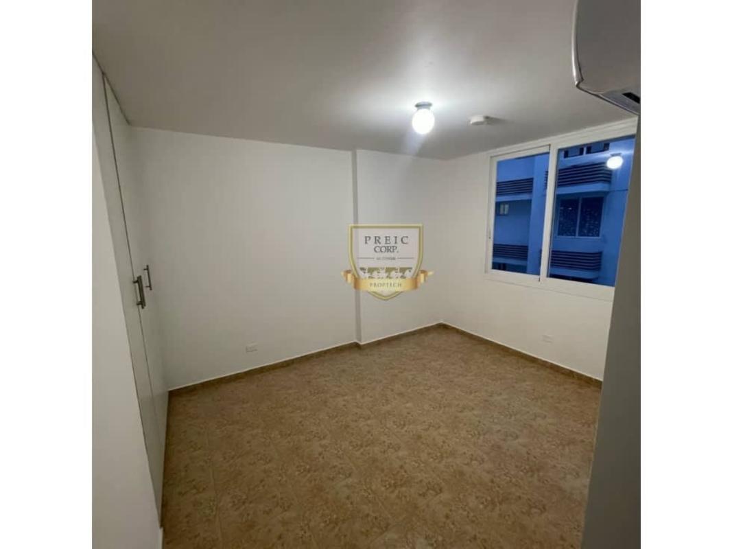 Kitchen with granite countertops, refrigerator, stove, laundry area in PH Cosmopolitan Towers Panama