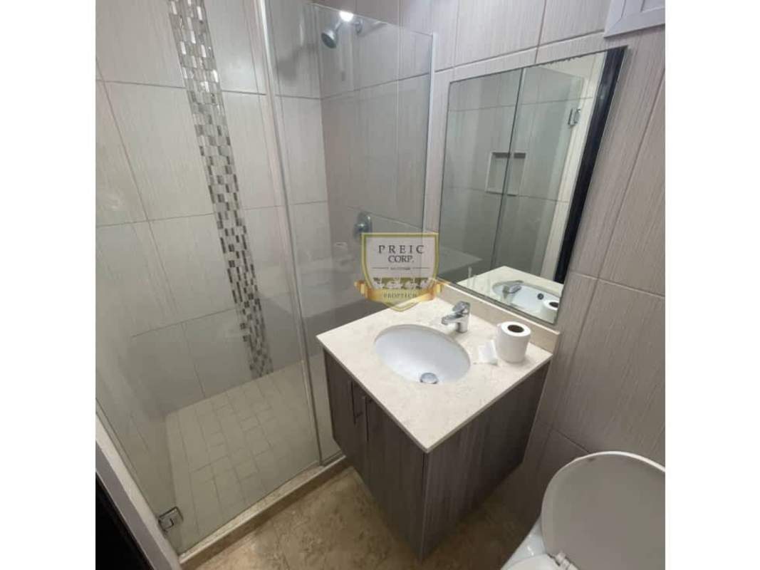 Modern bathroom with glass shower, vanity with mirror in PH Cosmopolitan Towers Panama City