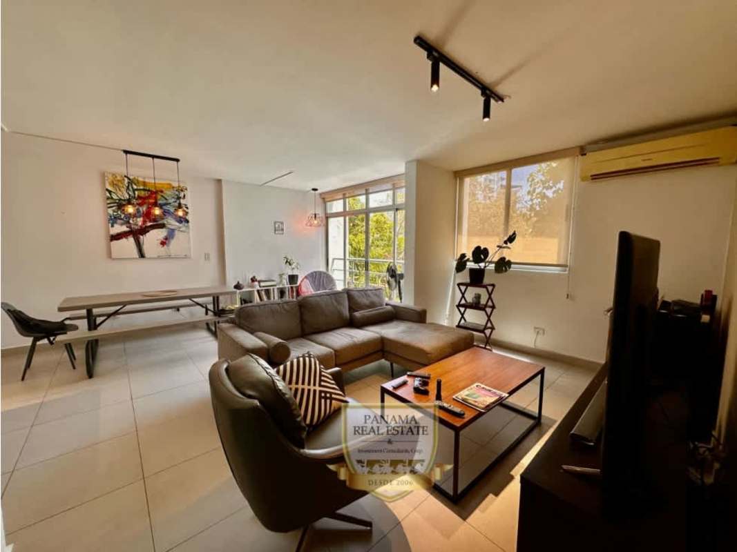 Bright living room with balcony access, tile floors, in PH Carrasquilla Park near Parque Omar Panama