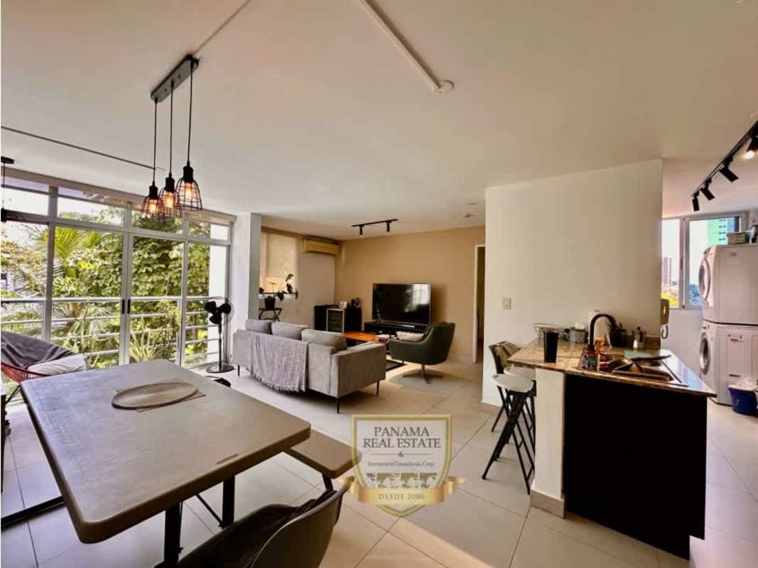 Kitchen with granite countertop, gas stove, range hood, washer/dryer in PH Carrasquilla Park Panama