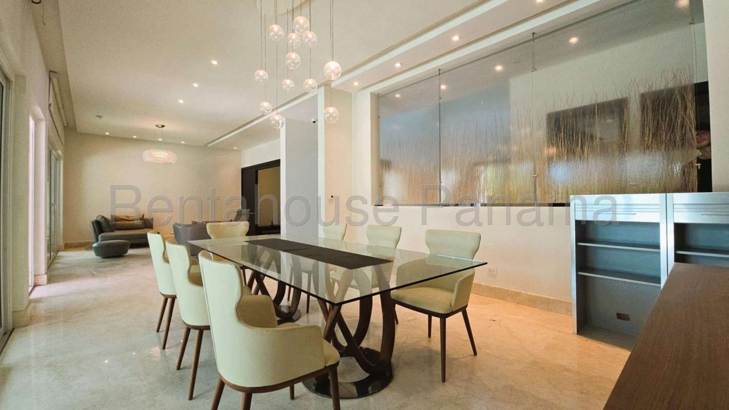 Contemporary kitchen with island, stainless appliances, large windows in Costa del Este home