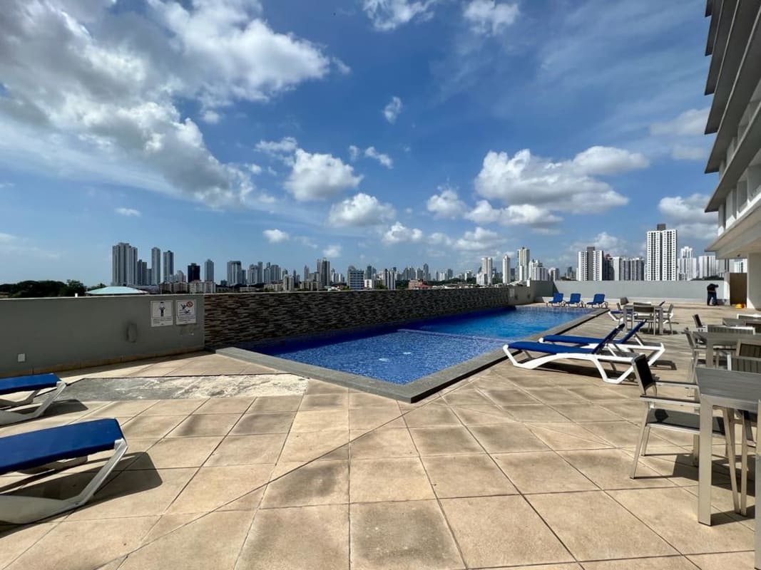 Children’s play area on rooftop terrace with play equipment in PH Alegría Panama City